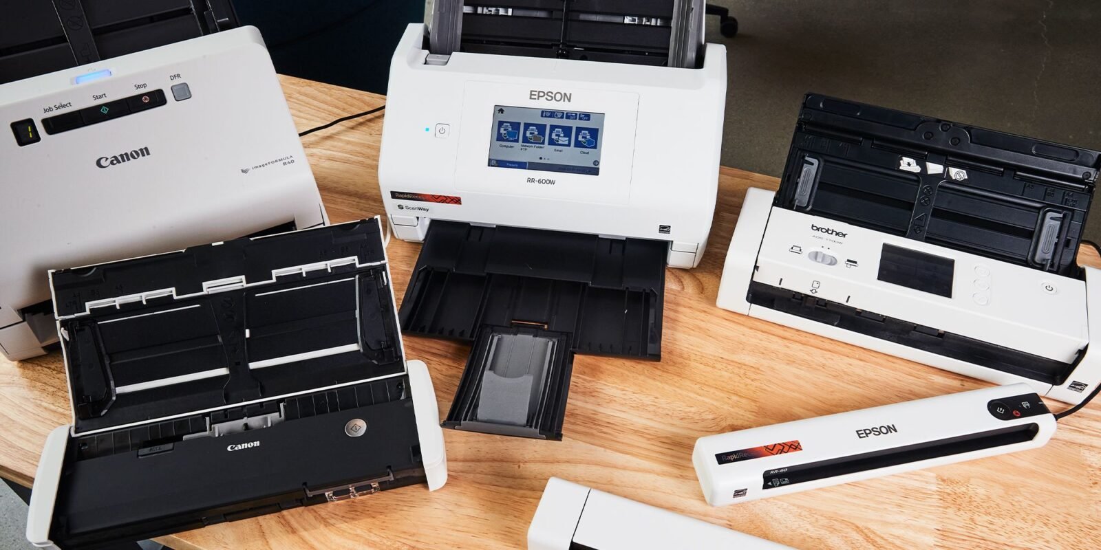 A diverse array of scanners, including models from Epson, Canon and Brother.