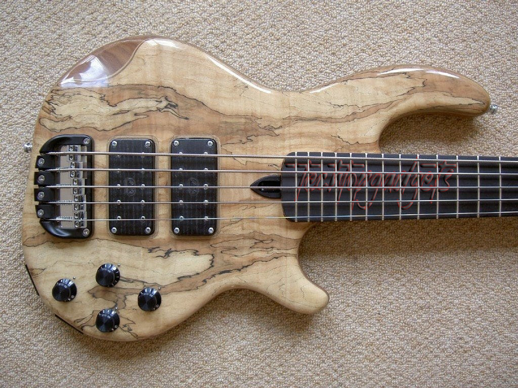 A unique exotic wood beginner bass with distinct grain patterns, offering both visual appeal and warm, vibrant tones for learners.