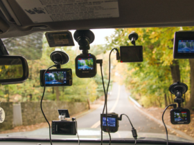A diverse selection of the best dash cams mounted on a car windshield, providing a multi-angle view of the road ahead for enhanced driving safety.