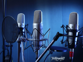 A professional studio setting showcasing three of the best microphones of 2024, each mounted on a sleek stand with shock mounts and pop filters, against a moody blue backdrop, highlighting the cutting-edge design and technology for superior audio capture.