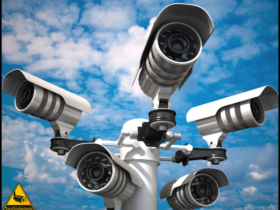 A cluster of advanced security cameras mounted on a single post, providing 360-degree surveillance against a backdrop of blue skies and fluffy clouds, ensuring comprehensive monitoring for the best outdoor security.