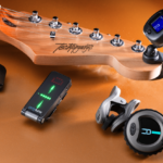 An ensemble of various clip-on guitar tuners, each promising to be the best in class, are stylishly arranged around a guitar headstock, showcasing the range of options available to guitarists.