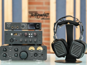 A high-end audio setup featuring some of the best headphone amplifiers on the market, including a prominent pair of headphones for an immersive listening experience.