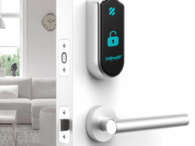 A state-of-the-art smart lock with camera installed on a white door, offering keyless entry and remote monitoring - a top contender for the best smart locks with camera for modern homes.