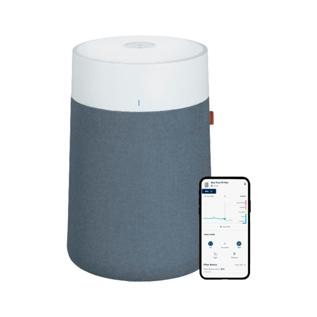 Highlighting its smart features, the Blueair Blue Pure 311i Max, one of the best home air purifiers for germs, is displayed alongside a smartphone illustrating its compatible app interface.