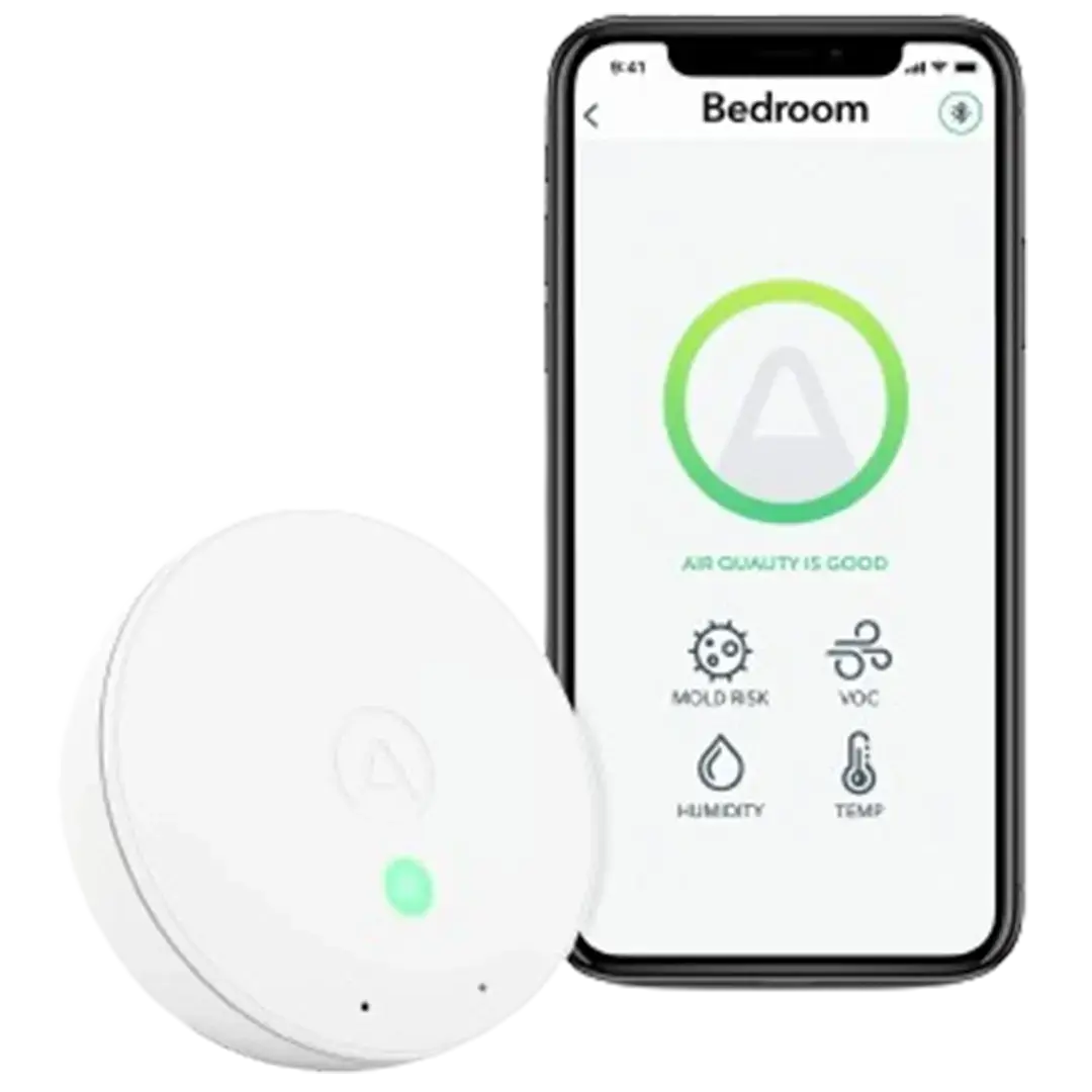 Smartphone displaying Airthings app alongside the Wave Mini, a contender for best indoor air quality monitor for mold with its compact design.