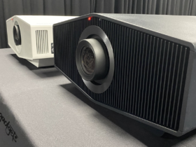 Two top-tier 4K projectors, exemplifying the best 4K projector under 2000, showcased side by side on a display table.