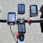 A cyclist's handlebar equipped with various gadgets, including the best bicycle speedometer for comprehensive cycling data.