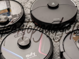 An array of top-performing budget robot vacuums with mapping technology, featuring brands like Eufy, Roborock, and Shark, showcased on a textured floor, exemplifying the fusion of affordability and advanced navigation in home cleaning tech.