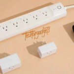 An assortment of smart outlets including a TP-Link Kasa Smart Wi-Fi Power Strip and a Govee Dual Smart Plug alongside an outdoor smart plug, all part of the best smart outlets collection for a modern, tech-savvy space. The image showcases the variety and versatility of smart plugs for indoor and outdoor use.