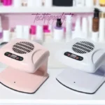 Side-by-side comparison of advanced air nail dryers in chic pink and classic white, designed for fast nail art drying.