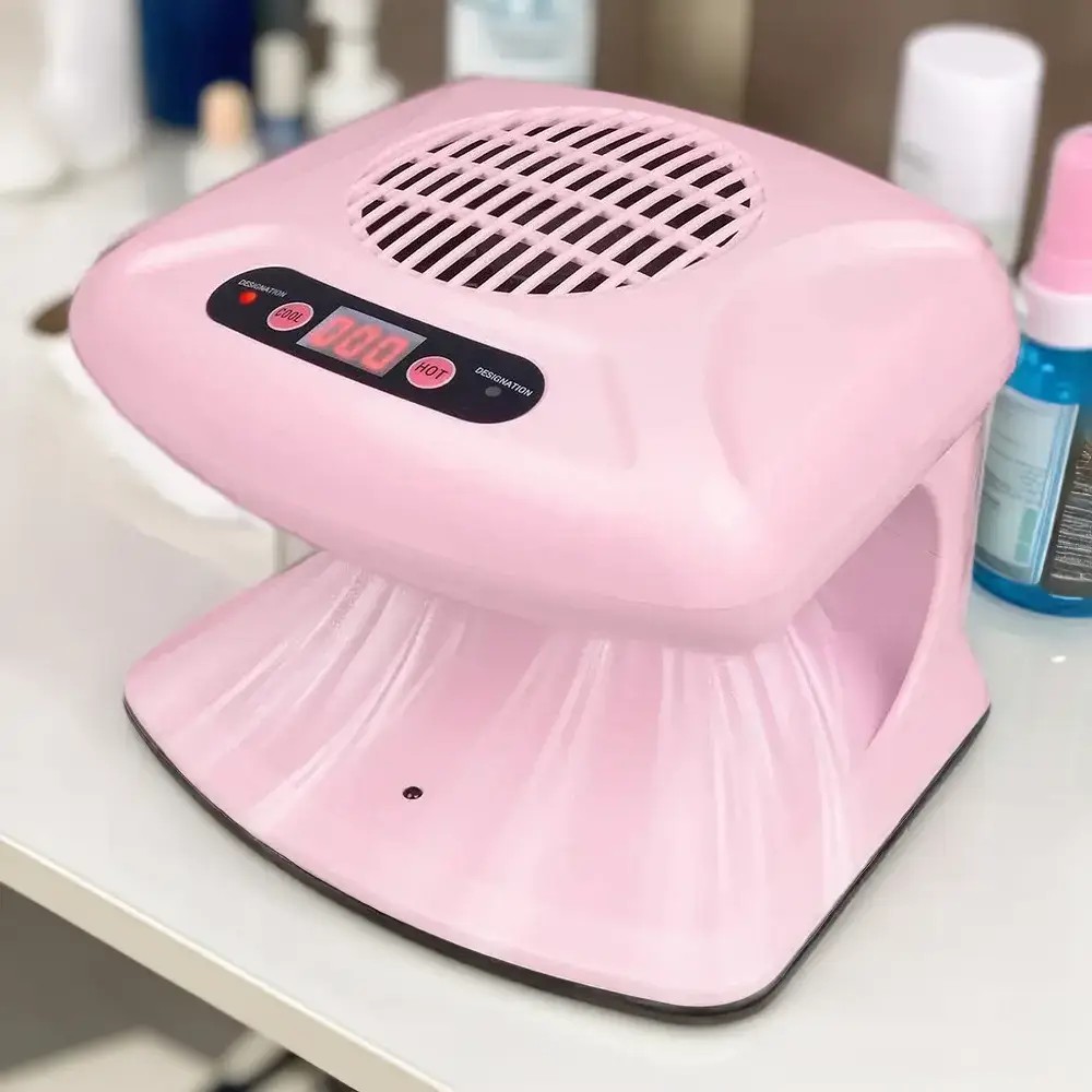 A pink air nail dryer featuring a digital timer display, essential for precise nail art drying sessions.