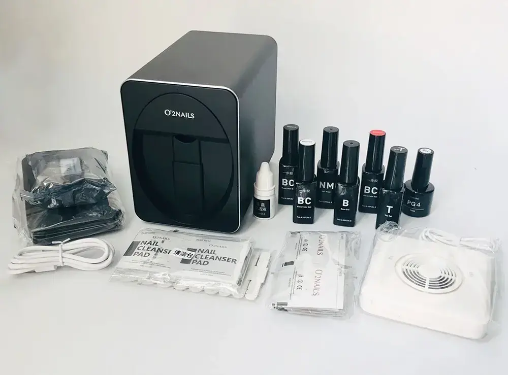 A digital nail art printer kit with associated nail polishes and cleansing pads, highlighting the working mechanism of digital nail art printers that bring salon-quality nail art into the home.